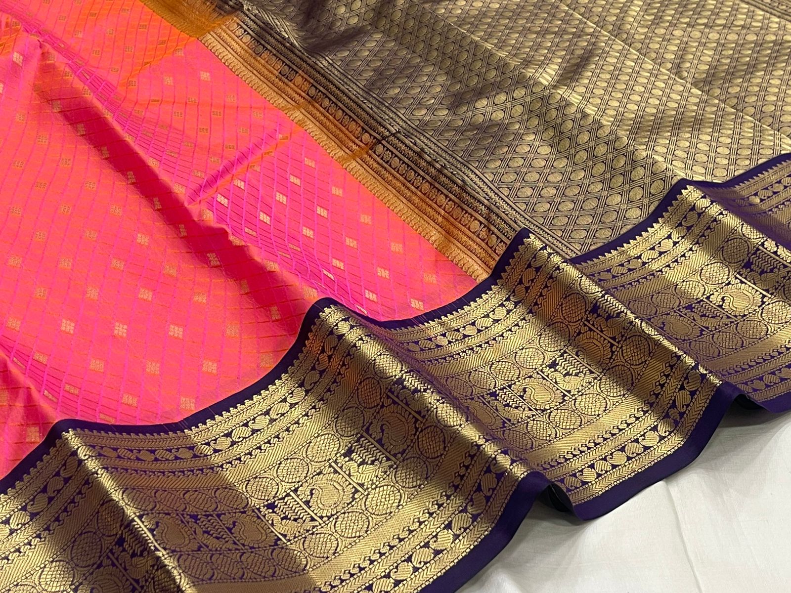 Rani Pink Kanjivaram Silk Saree with a Contrast Purple Zari Border.